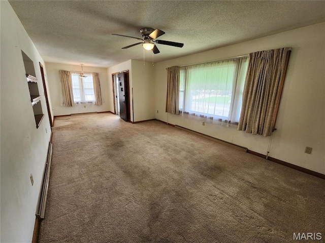 4028 Mcmasters Ave, Hannibal, MO 63401 - carpeted empty room featuring a textured ceiling, ceiling fan, and baseboards