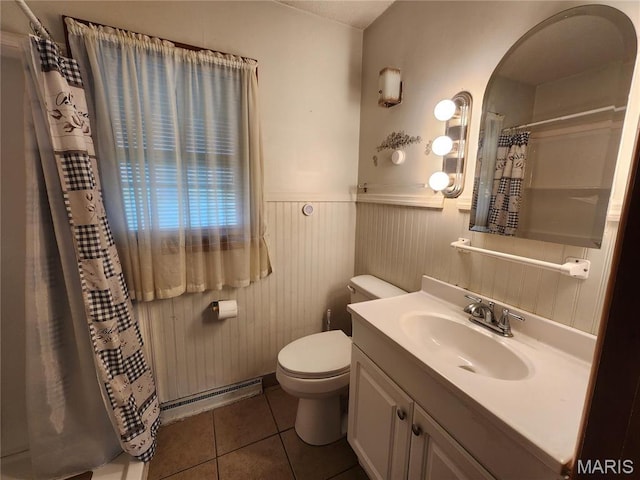 4028 Mcmasters Ave, Hannibal, MO 63401 - bathroom with tile patterned floors, wainscoting, toilet, a shower with shower curtain, and a baseboard radiator