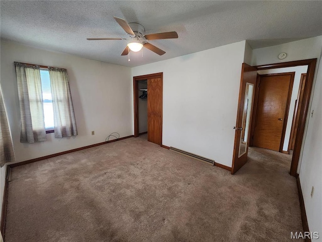 4028 Mcmasters Ave, Hannibal, MO 63401 - unfurnished bedroom featuring carpet floors, baseboards, a closet, a textured ceiling, and a ceiling fan