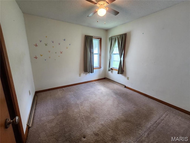 4028 Mcmasters Ave, Hannibal, MO 63401 - carpeted empty room featuring a ceiling fan, a textured ceiling, baseboards, and a baseboard heating unit