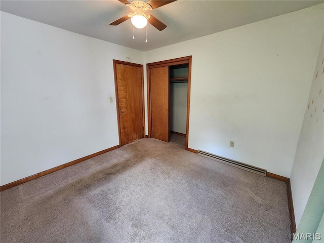 4028 Mcmasters Ave, Hannibal, MO 63401 - unfurnished bedroom featuring a baseboard radiator, carpet flooring, baseboards, and a closet