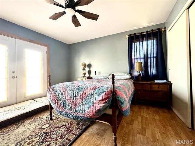 34 Kathryn Dr, St James, MO 65559 - bedroom featuring wood finished floors, multiple windows, french doors, and ceiling fan