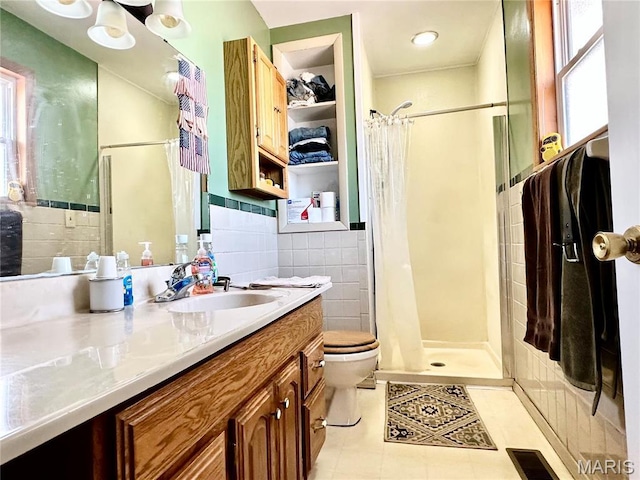 34 Kathryn Dr, St James, MO 65559 - full bathroom with a stall shower, tile walls, tile patterned flooring, toilet, and vanity