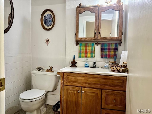 34 Kathryn Dr, St James, MO 65559 - bathroom featuring toilet, tile walls, vanity, and backsplash