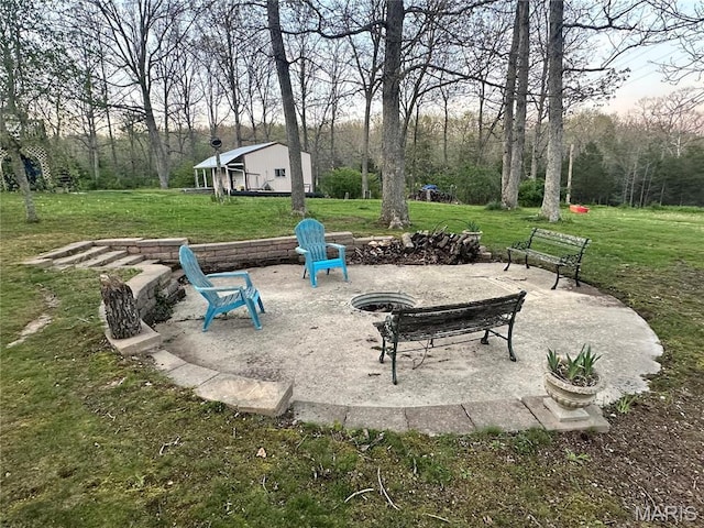 34 Kathryn Dr, St James, MO 65559 - view of property's community with an outdoor fire pit, a lawn, and a wooded view