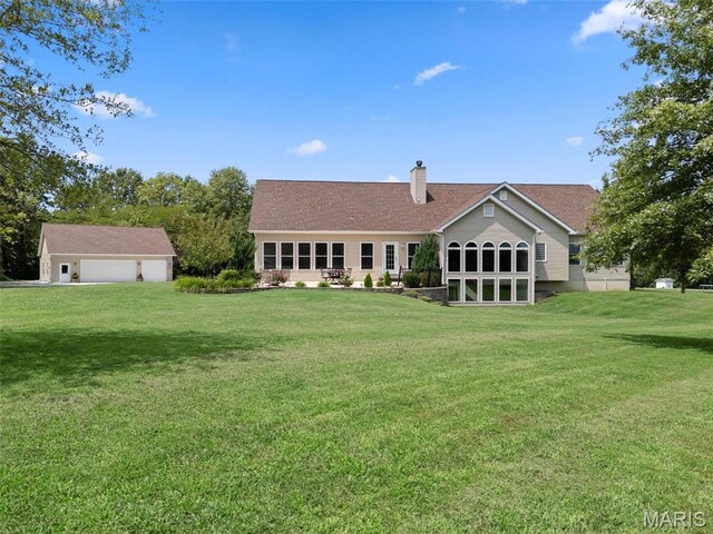 220 Cuivre Point Ln, Moscow Mills, MO 63362 - back of house featuring a garage, a chimney, and a yard