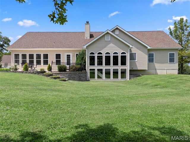 220 Cuivre Point Ln, Moscow Mills, MO 63362 - rear view of house with a chimney, a lawn, and a shingled roof