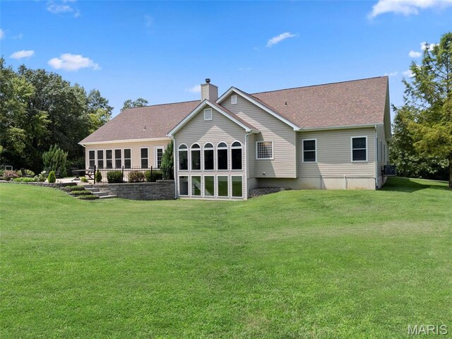 220 Cuivre Point Ln, Moscow Mills, MO 63362 - back of house with a chimney, a yard, and a shingled roof