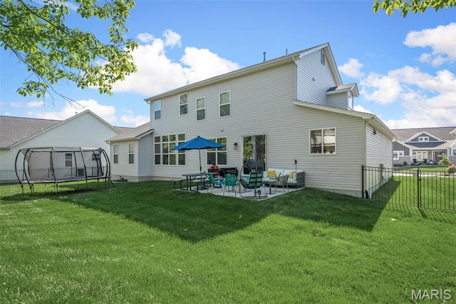 207 Castle Stuart Ct, Dardenne Prairie, MO 63368 - back of house featuring a trampoline and a patio