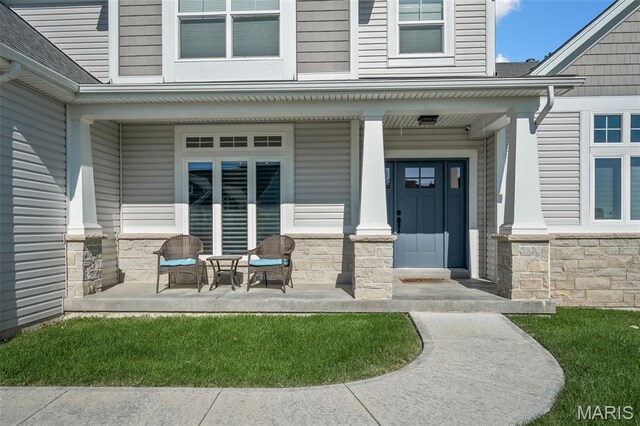 207 Castle Stuart Ct, Dardenne Prairie, MO 63368 - doorway to property with a porch, stone siding, and a shingled roof