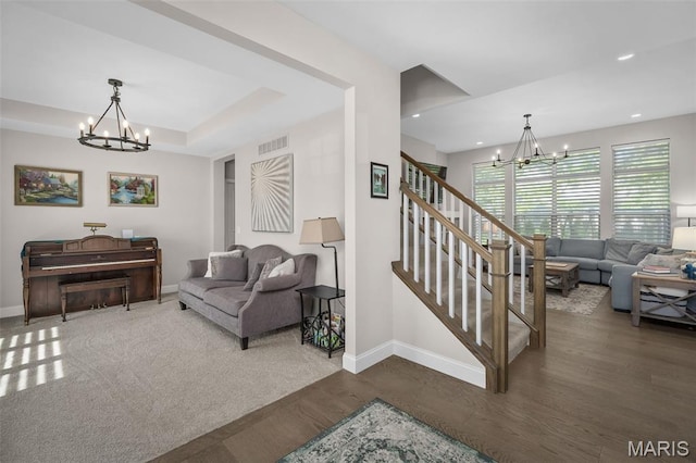207 Castle Stuart Ct, Dardenne Prairie, MO 63368 - living area featuring a chandelier, wood finished floors, baseboards, and recessed lighting