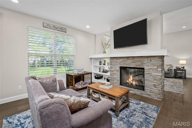207 Castle Stuart Ct, Dardenne Prairie, MO 63368 - living area with a stone fireplace, plenty of natural light, wood finished floors, baseboards, and recessed lighting