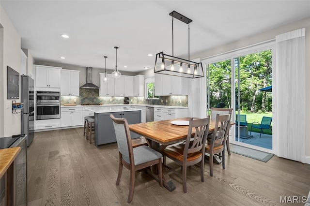 207 Castle Stuart Ct, Dardenne Prairie, MO 63368 - dining room with wood finished floors and recessed lighting