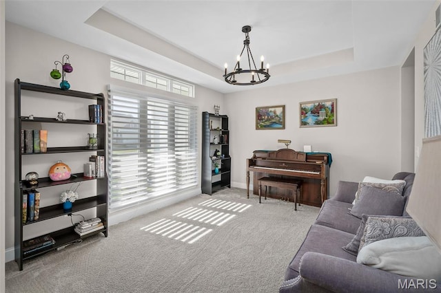 207 Castle Stuart Ct, Dardenne Prairie, MO 63368 - sitting room featuring a chandelier, a raised ceiling, carpet flooring, and baseboards
