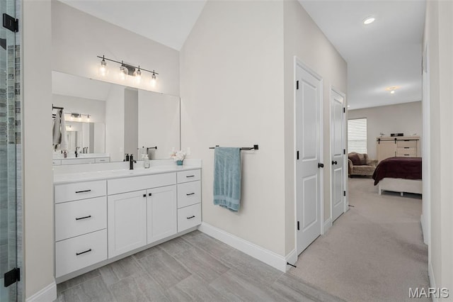 207 Castle Stuart Ct, Dardenne Prairie, MO 63368 - bathroom featuring baseboards, ensuite bath, vanity, lofted ceiling, and a shower with shower door