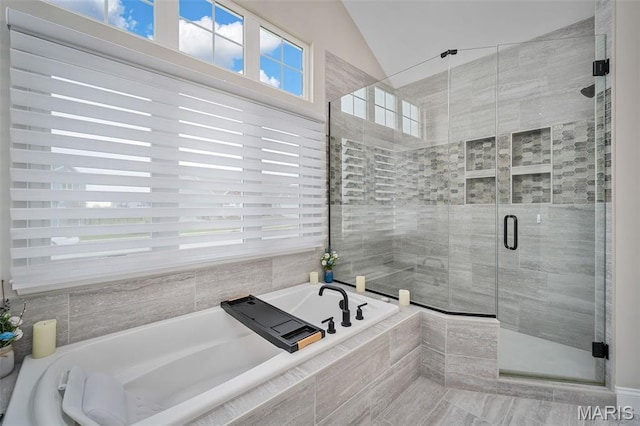 207 Castle Stuart Ct, Dardenne Prairie, MO 63368 - bathroom featuring lofted ceiling, a shower stall, and a garden tub