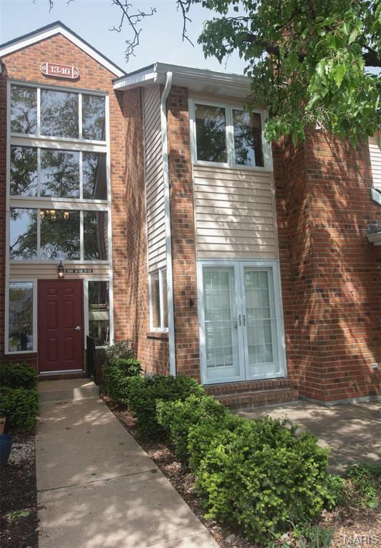 1340 Holgate Dr Unit F2, Ballwin, MO 63021 - view of front of home featuring french doors and brick siding