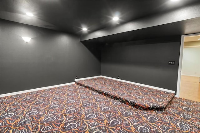 carpeted empty room with baseboards and recessed lighting