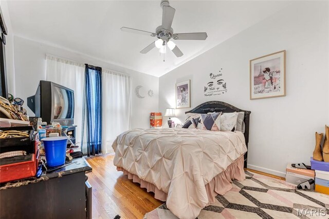 10457 Briarbend Dr Unit 8, Saint Louis, MO 63146 - bedroom with light wood-style flooring and ceiling fan