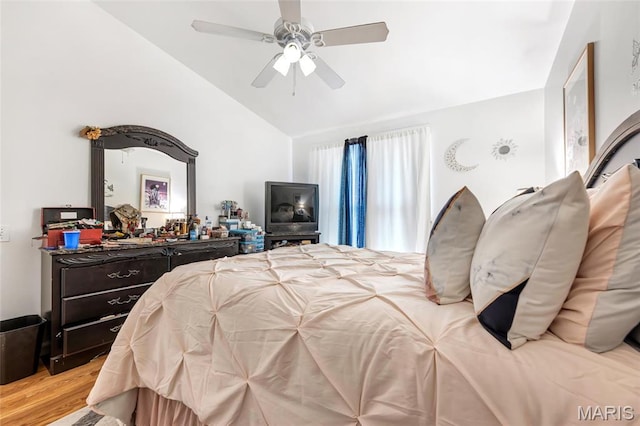 10457 Briarbend Dr Unit 8, Saint Louis, MO 63146 - bedroom with vaulted ceiling, light wood-style flooring, and ceiling fan