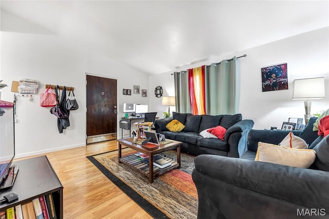 10457 Briarbend Dr Unit 8, Saint Louis, MO 63146 - living area featuring lofted ceiling, light wood-style flooring, and baseboards