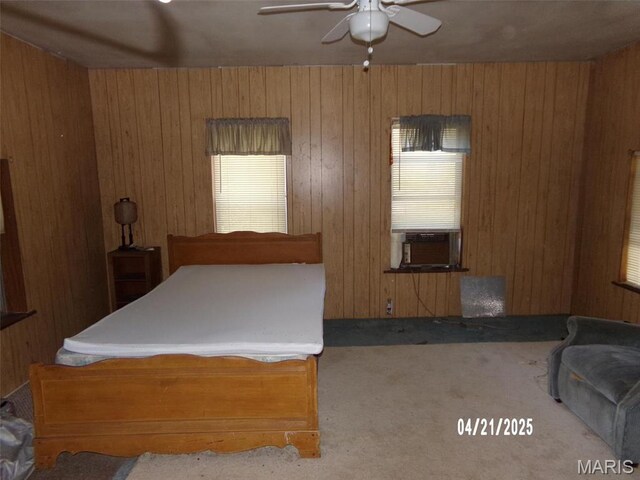 2163 Welch Dr, Hermann, MO 65041 - bedroom featuring cooling unit, carpet, wood walls, and a ceiling fan