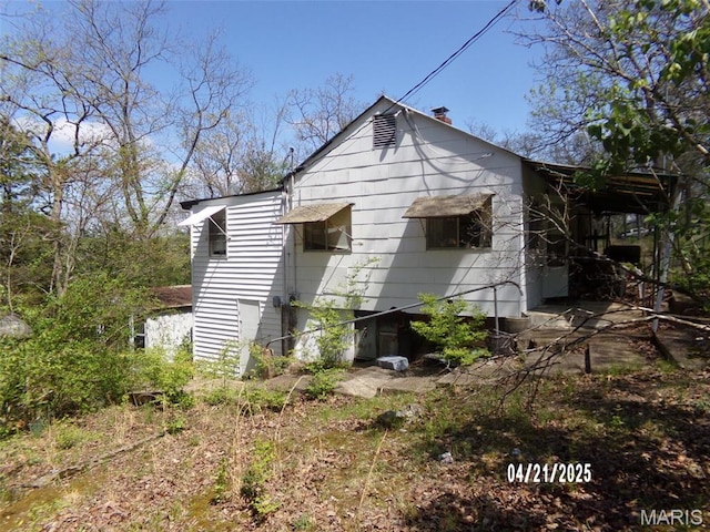 2163 Welch Dr, Hermann, MO 65041 - back of property featuring a chimney