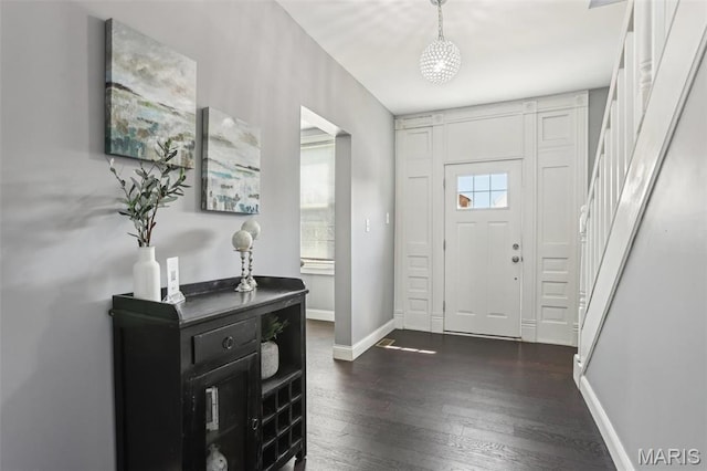 5327 W Ave, Saint Louis, MO 63116 - foyer with dark wood finished floors, stairway, and baseboards