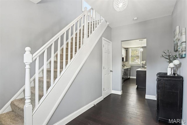 5327 W Ave, Saint Louis, MO 63116 - staircase featuring hardwood / wood-style floors and baseboards