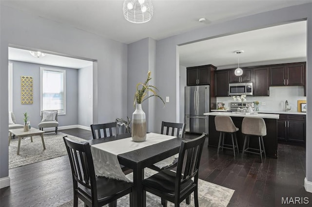 5327 W Ave, Saint Louis, MO 63116 - dining room with dark wood-style flooring and baseboards