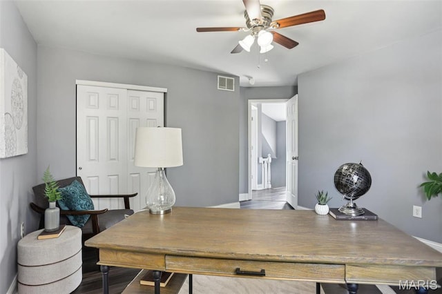 5327 W Ave, Saint Louis, MO 63116 - office with ceiling fan, baseboards, and wood finished floors