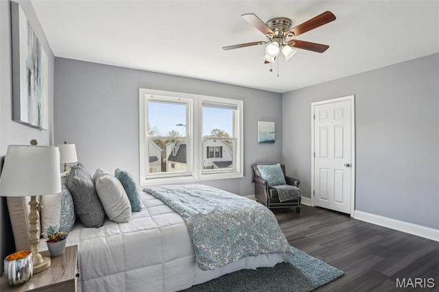 5327 W Ave, Saint Louis, MO 63116 - bedroom featuring dark wood-style flooring, baseboards, and a ceiling fan