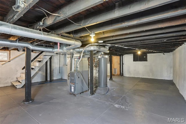 5327 W Ave, Saint Louis, MO 63116 - below grade area with gas water heater, stairs, washer / clothes dryer, heating unit, and electric panel
