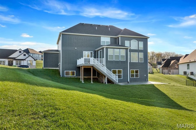 215 Everett Creek Ct, Lake St Louis, MO 63367 - rear view of property featuring stairway, a patio area, a lawn, and a wooden deck