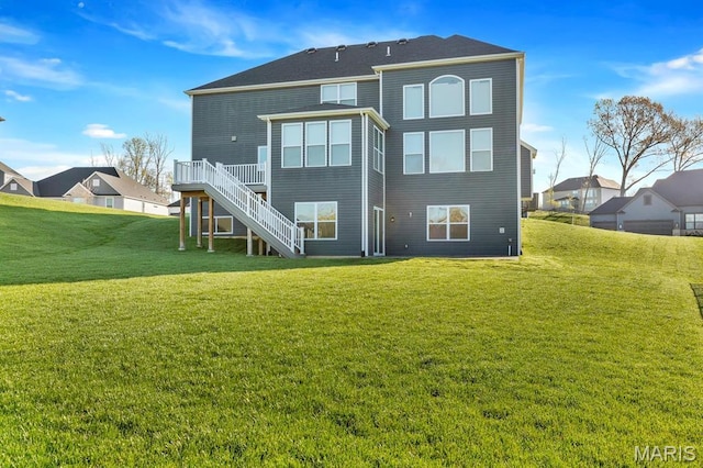 215 Everett Creek Ct, Lake St Louis, MO 63367 - back of house with stairs, a wooden deck, and a lawn