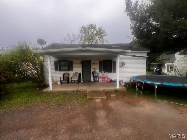 316 N 6th St, Mount Vernon, IL 62864 - back of house with a trampoline and a porch