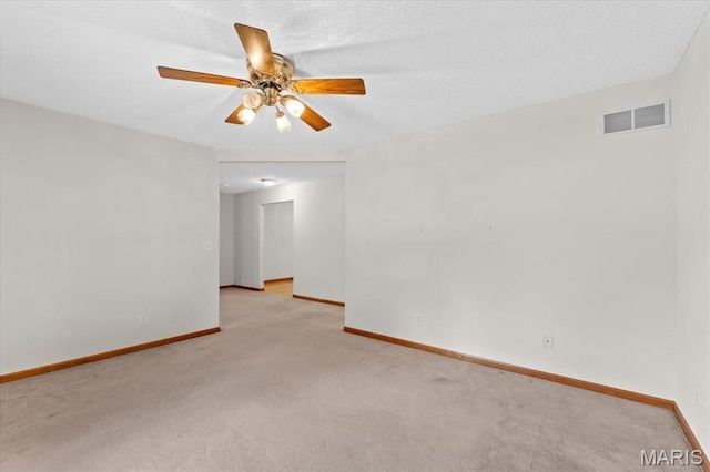 2305 Loretta Ln, Collinsville, IL 62234 - unfurnished room featuring light carpet, a ceiling fan, and baseboards