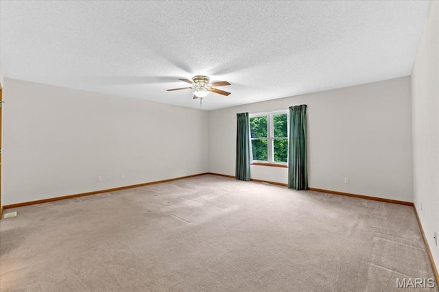 2305 Loretta Ln, Collinsville, IL 62234 - empty room featuring ceiling fan, carpet, a textured ceiling, and baseboards