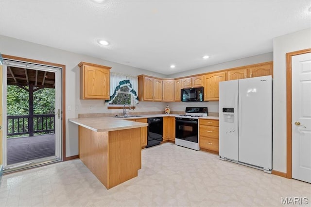 2305 Loretta Ln, Collinsville, IL 62234 - kitchen featuring black appliances, a sink, a peninsula, light countertops, and recessed lighting