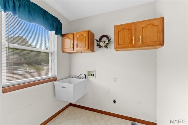 2305 Loretta Ln, Collinsville, IL 62234 - laundry area featuring cabinet space, hookup for a washing machine, hookup for an electric dryer, light floors, and baseboards