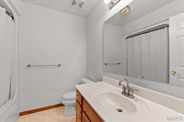 2305 Loretta Ln, Collinsville, IL 62234 - full bath with vanity, toilet, tile patterned floors, a textured ceiling, and baseboards