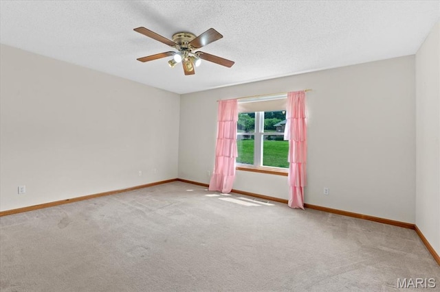 2305 Loretta Ln, Collinsville, IL 62234 - spare room featuring carpet floors, ceiling fan, baseboards, and a textured ceiling
