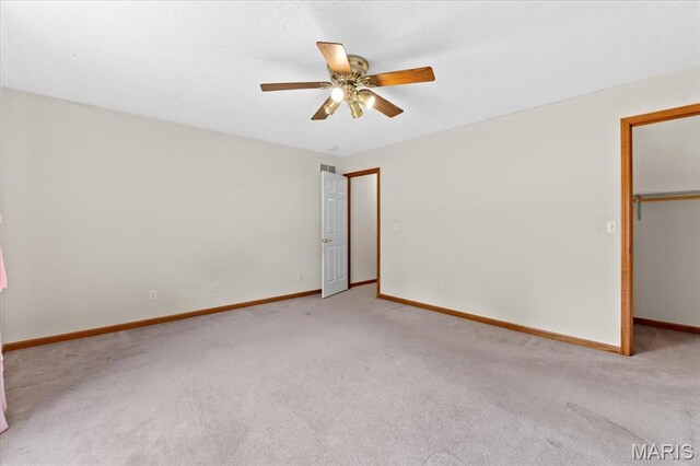 2305 Loretta Ln, Collinsville, IL 62234 - spare room featuring carpet floors, ceiling fan, and baseboards