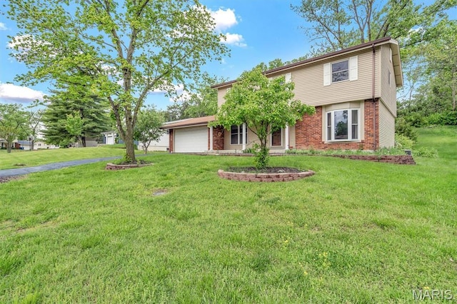 view of front facade with a garage, a front yard, brick siding, and driveway