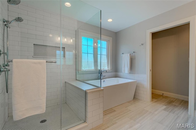 734 Fuhrmann Ter, Glendale, MO 63122 - full bathroom with a stall shower, a freestanding bath, recessed lighting, and tile walls