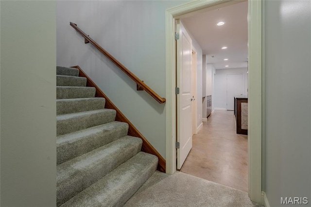 734 Fuhrmann Ter, Glendale, MO 63122 - stairway featuring recessed lighting, concrete floors, and baseboards