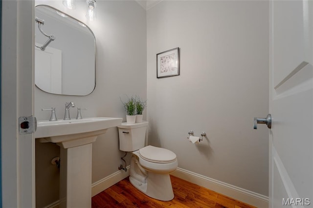 734 Fuhrmann Ter, Glendale, MO 63122 - half bath featuring toilet, wood finished floors, and baseboards