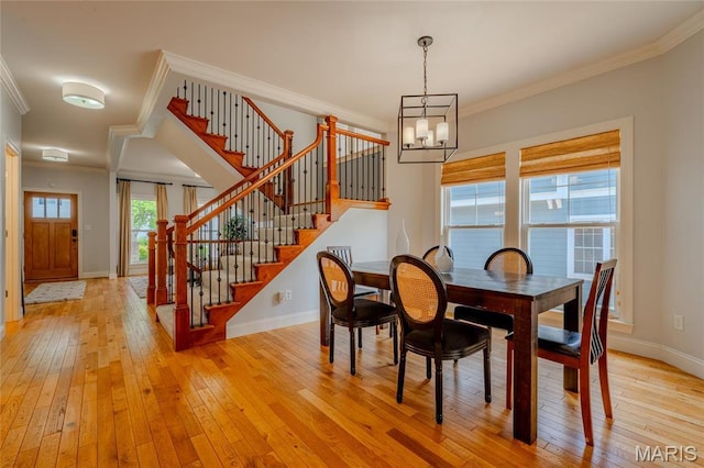 734 Fuhrmann Ter, Glendale, MO 63122 - dining space with a chandelier, light wood-type flooring, stairway, baseboards, and ornamental molding