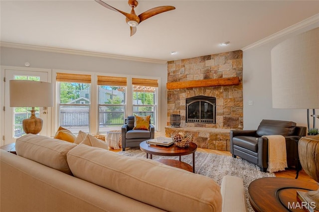 734 Fuhrmann Ter, Glendale, MO 63122 - living room with ornamental molding, a stone fireplace, a ceiling fan, and wood finished floors