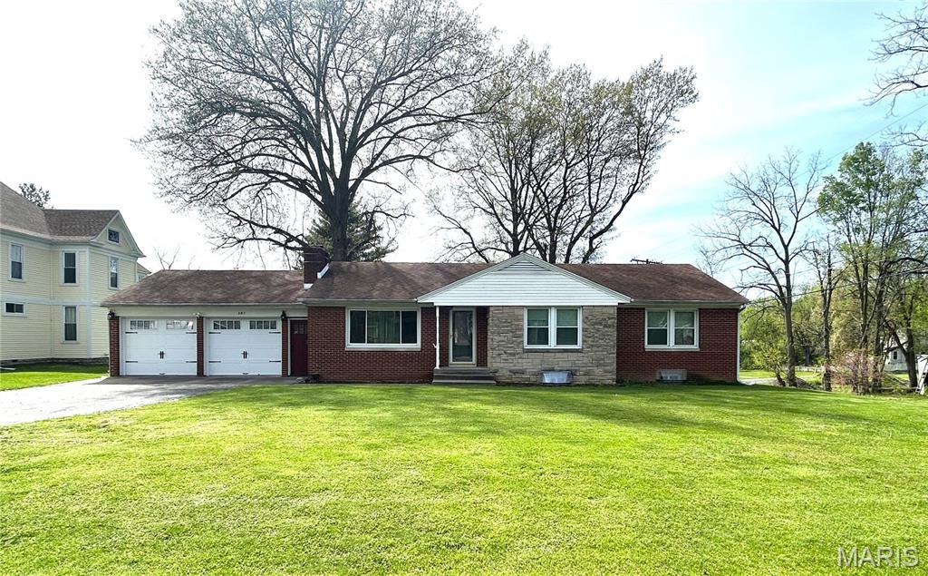 301 S Main, White Hall, IL 62092 - single story home with a garage, asphalt driveway, and a front lawn